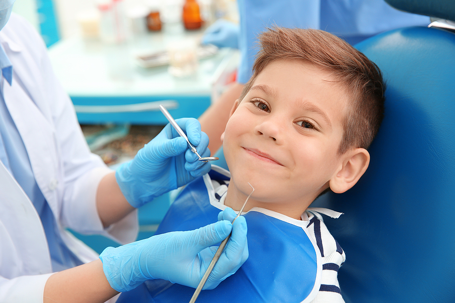 What are the benefits of seeing a pediatric dentist early?